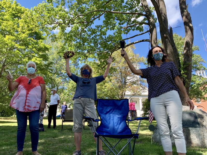 From left, Jennifer Spaur, Terri Wells and Sherri Dunbar ring bells on Wiscasset Common Sept. 6 at a picnic marking the conclusion of two churches’ daily noontime ringing of their bells as residents have rung bells in the pandemic. SUSAN JOHNS/Wiscasset Newspaper