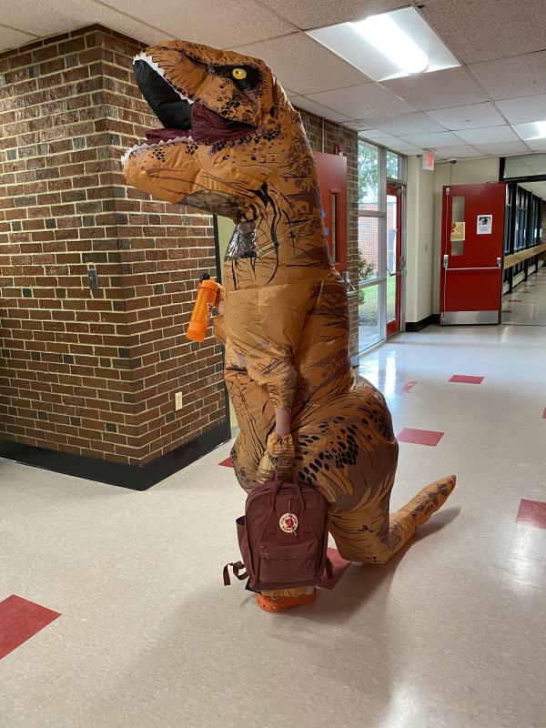 Junior Reese Hesseltine shows spirit going as a dinosaur. Deb Pooler photo