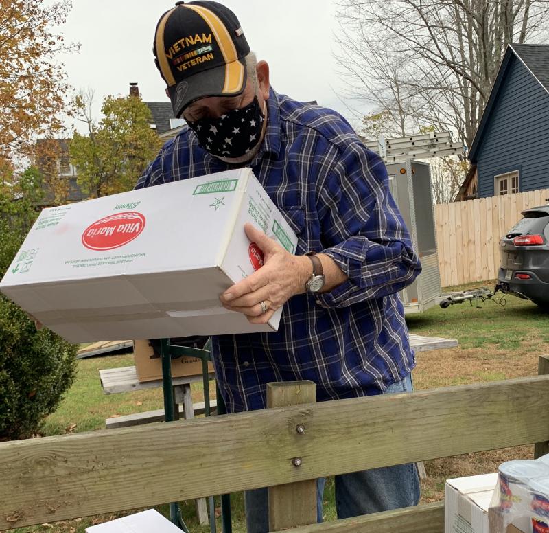 Wiscasset’s Chuck Billings, who served in Vietnam with the U.S. Guard, helps pack Feed Our Scholars supplies at St. Philip’s Episcopal Church Nov. 6 for the trip to First Congregational Church. SUSAN JOHNS/Wiscasset Newspaper