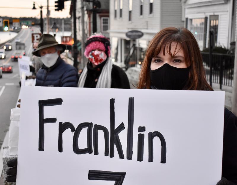 Kelli Whitlock Burton of Waldoboro holds a sign representing Franklin County, which has had seven COVID-19 deaths. Behind her are Tom Eichler and Wendy Ross of Wiscasset. PHIL DI VECE/Wiscasset Newspaper
