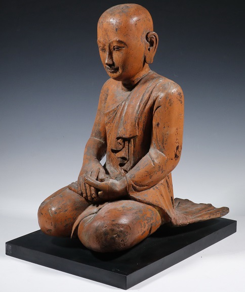 18th century Burmese Buddhist temple carved wooden kneeling disciple figure. Courtesy of Thomaston Place