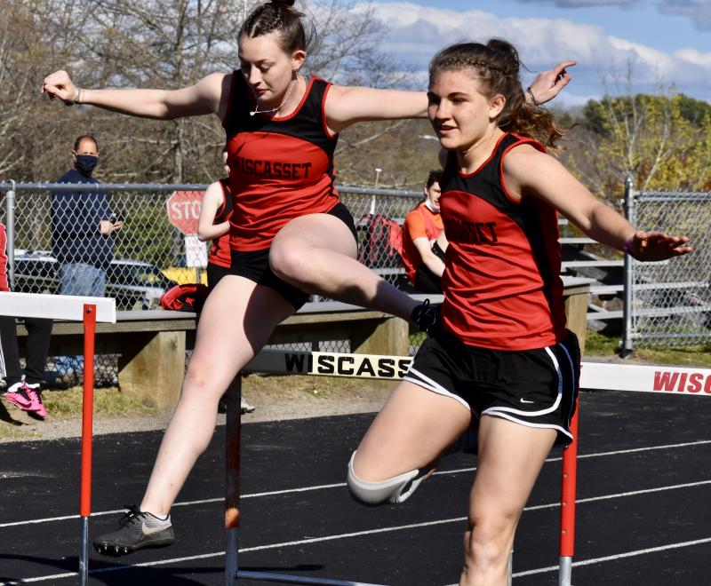 Gwen Webber, left, and Josie Harrington compete in the hurdles. PHIL DI VECE/Wiscasset Newspaper