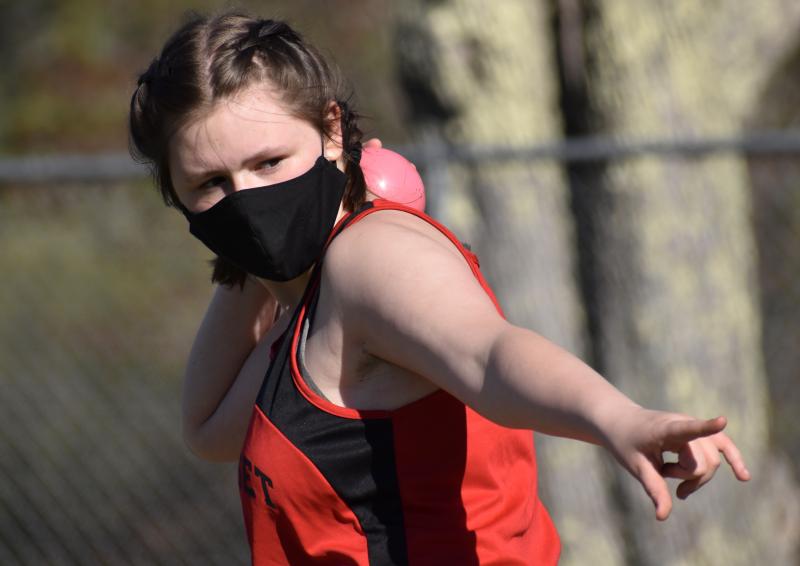 Alivia Orr warms up to throw the shot put. PHIL DI VECE/Wiscasset Newspaper