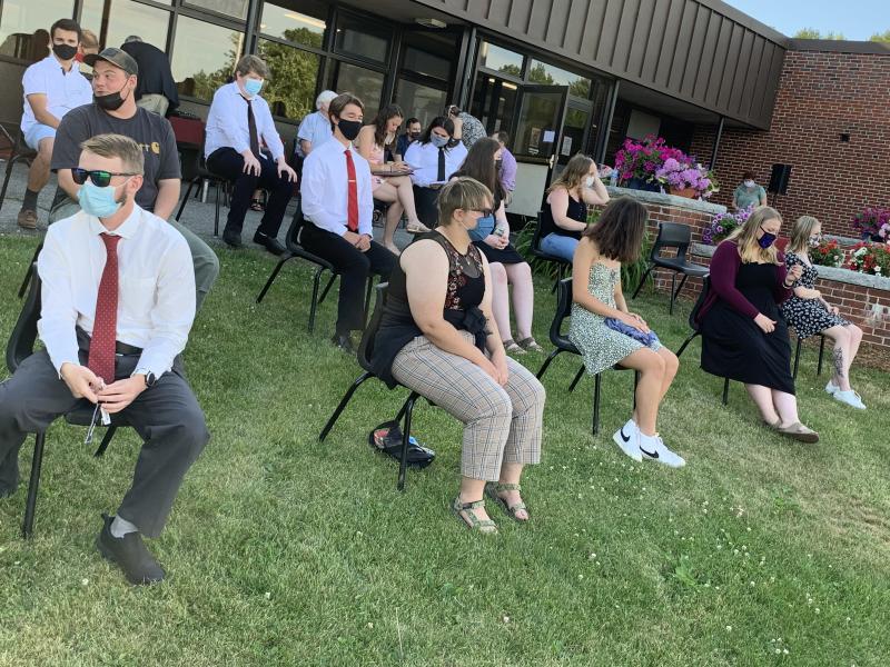 Seniors sit on the school lawn opposite their families seated facing the school. SUSAN JOHNS/Wiscasset Newspaper