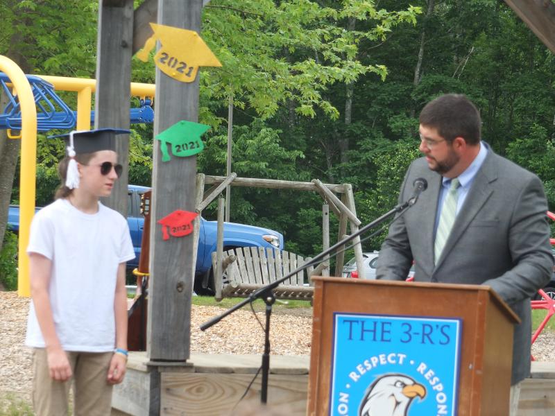 Principal Ira Michaud congratulates sixth grade graduate Royce Rogers June 14. BILL PEARSON/Boothbay Register