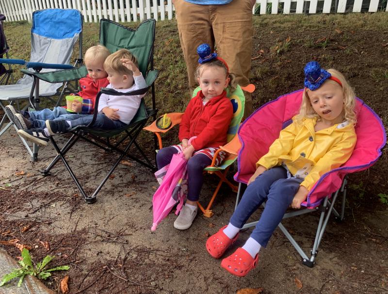 From left, Easton Griffin and Julian Bonnell, both 2, and Caroline Bonnell and Evelyn Griffin, both 4, await Wiscasset’s Fourth of July parade on Hooper Street Sunday. SUSAN JOHNS/Wiscasset Newspaper