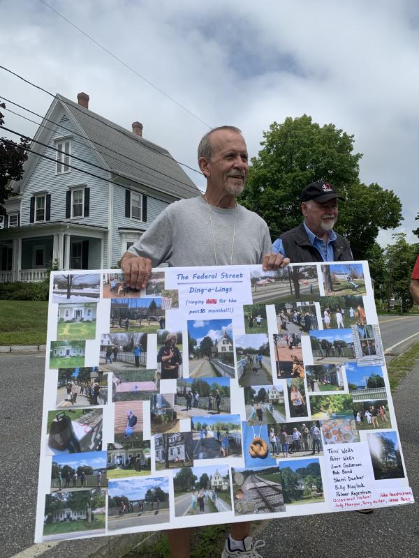 Peter Wells holds a poster of group memories. At right, Bob Bond. SUSAN JOHNS/Wiscasset Newspaper