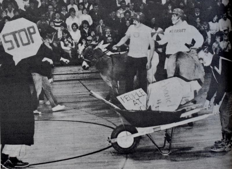 Wiscasset High School hosted a donkey basketball game in March 1985. On the right behind the wheelbarrow is former athletic director and phys ed teacher Eugene Stover. He volunteered to be part of the cleanup crew. That’s Bob MacDonald holding the basketball and Lloyd Savage, both members of Wiscasset Fire Department’s team. Phil Di Vece photo