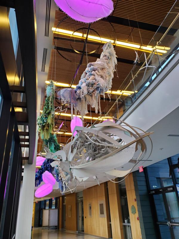 A new, two-story art installation that celebrates ocean life and scientific efforts hangs from the ceiling at Bigelow Laboratory for Ocean Sciences. Courtesy of Bigelow Laboratory