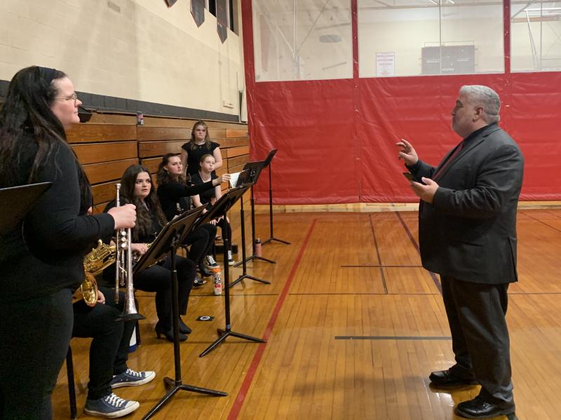 Principal Charles Lomonte meets with the band. It played during dinner. SUSAN JOHNS/Wiscasset Newspaper