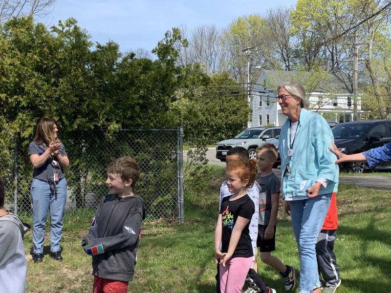 Stover and class take in the cheers on arrival at the outdoor classroom. SUSAN JOHNS/Wiscasset Newspaper