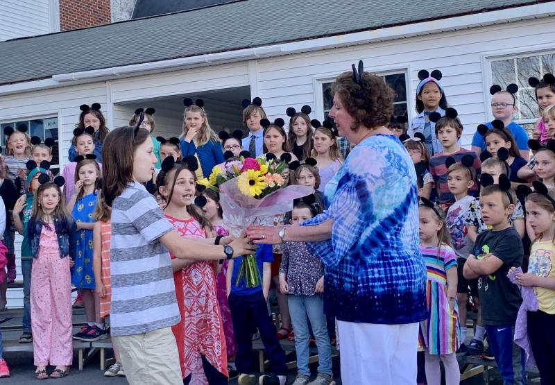 From left, third graders Gabriel Nelson and Amesley Franssen present flowers to WES music teacher Carole Drury. SUSAN JOHNS/Wiscasset Newspaper