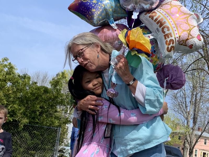 Wiscasset Elementary School second grader Giemella Absalud and first grade teacher Trae Stover hug at a May 13 celebration, the morning after Stover was named Lincoln County teacher of the year. SUSAN JOHNS/Wiscasset Newspaper