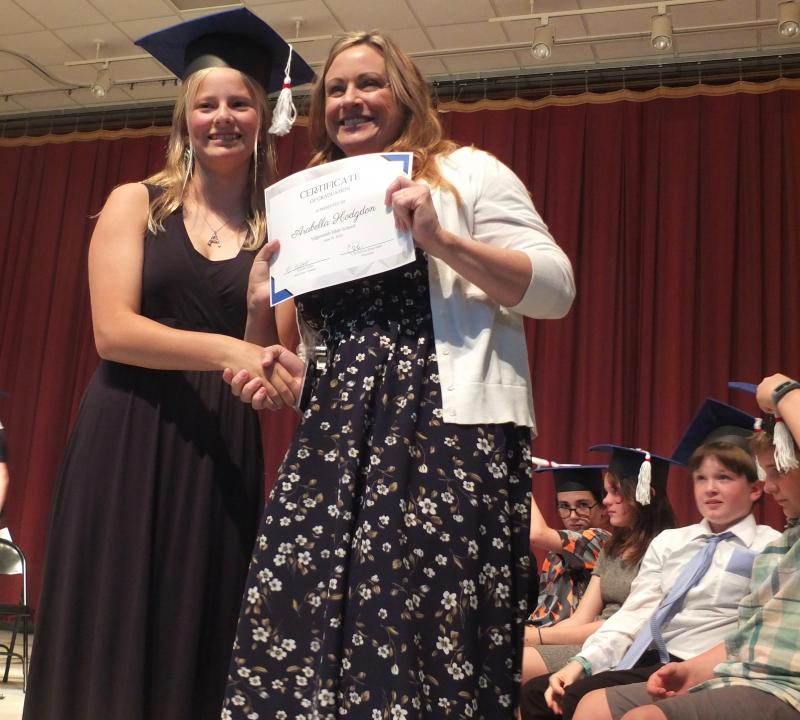 Arabella Hodgdon receives her sixth grade diploma from Principal Dr. Christina Boursaw. BILL PEARSON/Boothbay Register