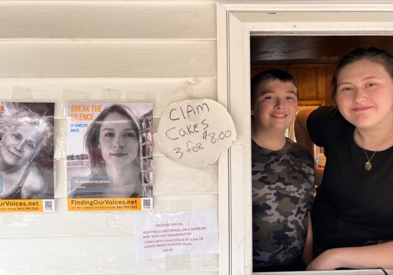 Nataleigh Haiden accepts an FOV poster at Karen’s Hideaway. Patrisha McLean photo