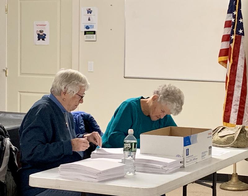 Longstanding Woolwich ballot clerks Jane Albert, left, and Mary King conduct the selectmen’s race recount Nov. 14 at the municipal building. SUSAN JOHNS/Wiscasset Newspaper