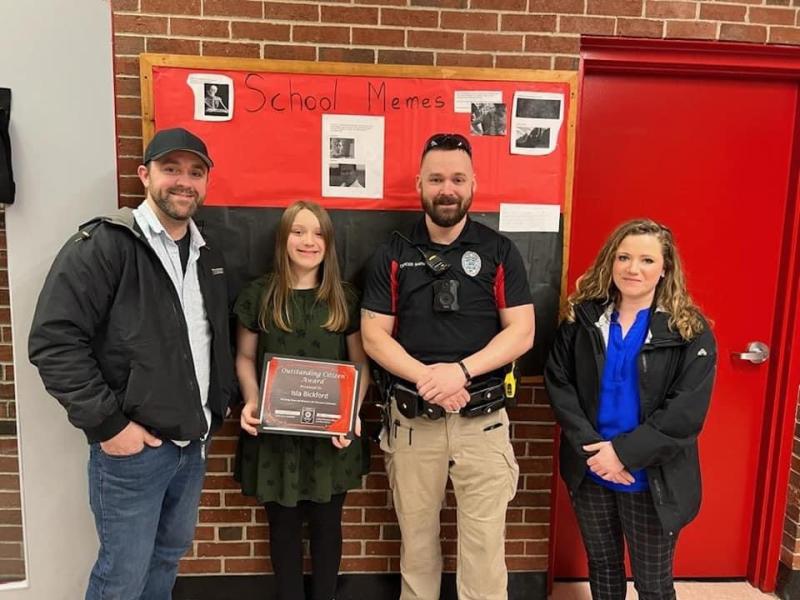 Wiscasset School Resource Officer Jonathan Barnes and Wiscasset Police Department’s latest “Outstanding Citizen,” WMHS sixth grader Isla Bickford, with Bickford’s mother KC Fairfield, far right, and father Tony Bickford, far left. Courtesy of Wiscasset Police Department
