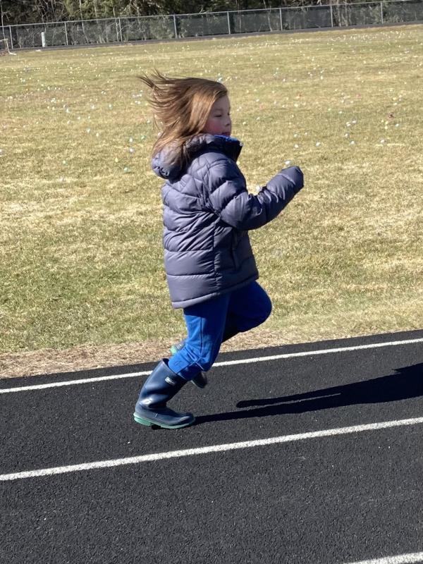 Liam Aarons, 7, from Woolwich runs on the track to stay warm while waiting for the hunt. EDNA MILLER/Wiscasset Newspaper