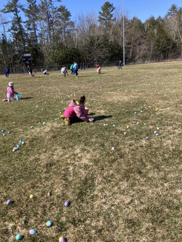 Easter egg hunter gathering eggs. EDNA MILLER/Wiscasset Newspaper