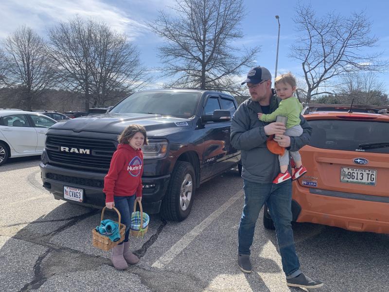 Wiscasset’s Zach Gray, daughter Zoey and son Zander head for the egg hunt. SUSAN JOHNS/Wiscasset Newspaper