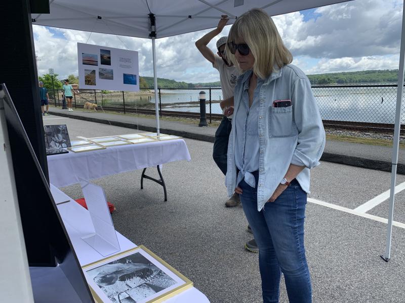 Lisa Hargreaves checks out an exhibit on Wiscasset’s worm-digging heritage. SUSAN JOHNS/Wiscasset Newspaper