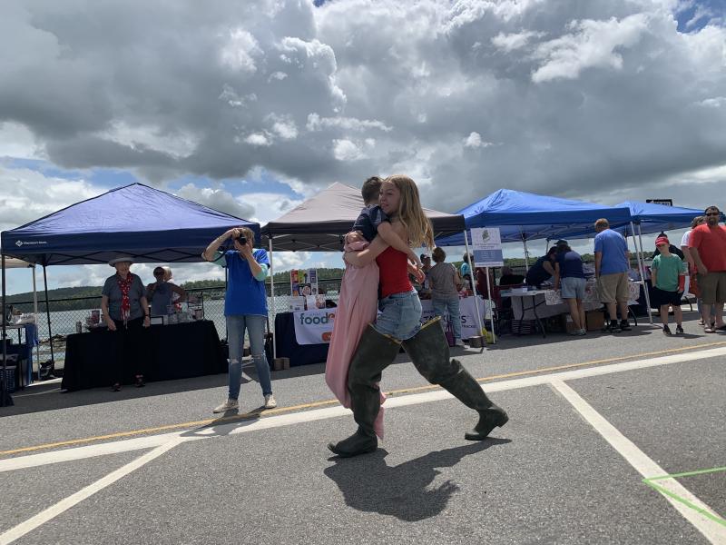 Emmalyn Tarrance, 13, carries brother Henry Tarrance, 8, in the relay. SUSAN JOHNS/Wiscasset Newspaper