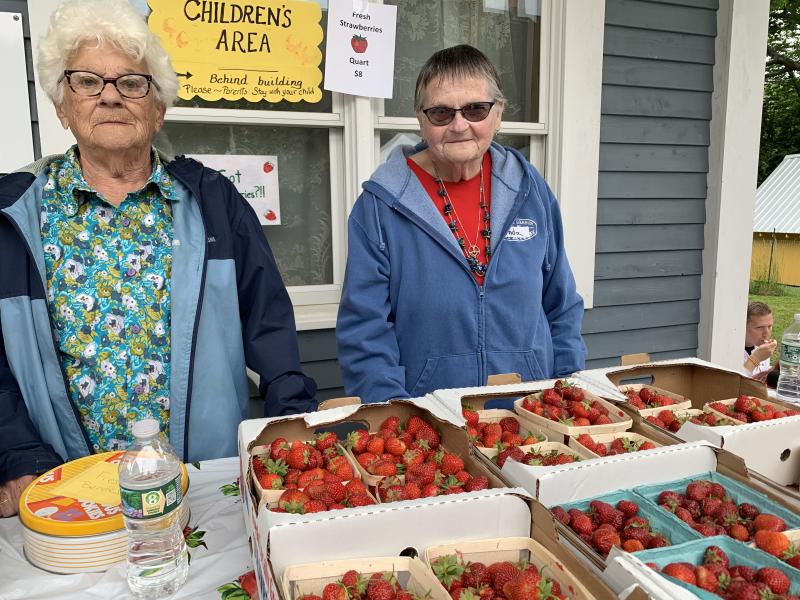 St. Philip’s Episcopal Church lifelong members Delia Dalton, left, and Linda Trowbridge help as usual at the Hodge Street, Wiscasset church’s Strawberry Festival June 29. SUSAN JOHNS/Wiscasset Newspaper