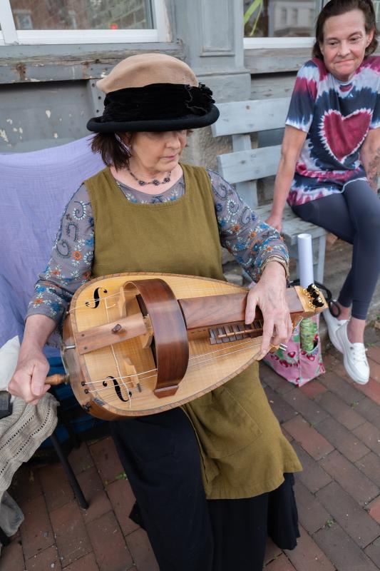Musician Laurie Rousseau, in costume, plays hurdy-gurdy during the June Wiscasset Art Walk. Bob Bond/40 Federal Studio