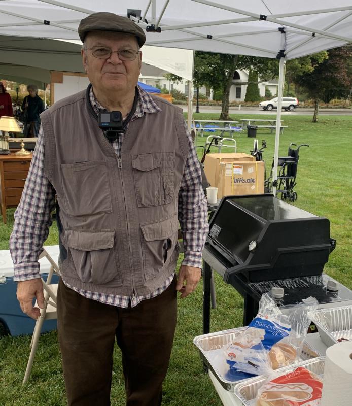 Doug Long was in charge of the grill during the yard sale. BILL PEARSON/Boothbay Register