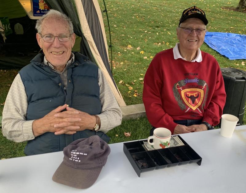 Korean War vet Al Sirois and Vietnam vet Jim Singer handled the yard sale cash Oct. 5 at the Boothbay Common event. BILL PEARSON/Boothbay Register Money men