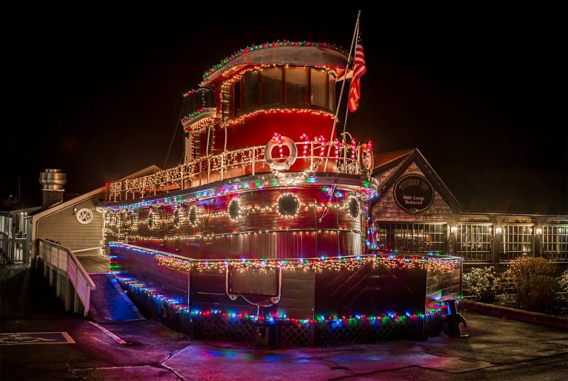 ISO 800 1/40th - f/5.6 - This shot was underexposed to capture all of the tonality - in auto mode the lights would have been blown out. I wanted to see detail on the structure and the colors of the lights and underexposing this allow for that. Michael Leonard photo Tugboat Inn