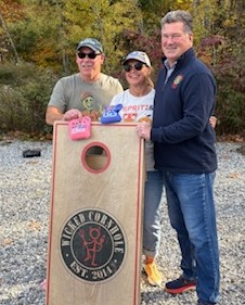 Chris and Tammy Plummer with Mike Hall. Courtesy photo cornhole competitors