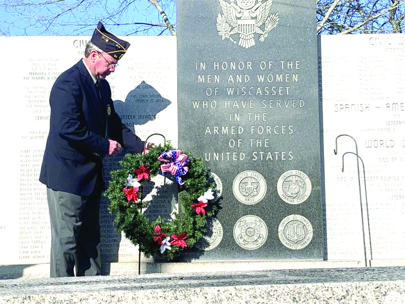Neil Page of American Legion Post 54 places a wreath at the veterans wall in Wiscasset Nov. 11. SUSAN JOHNS/Wiscasset Newspaper Veterans Day service