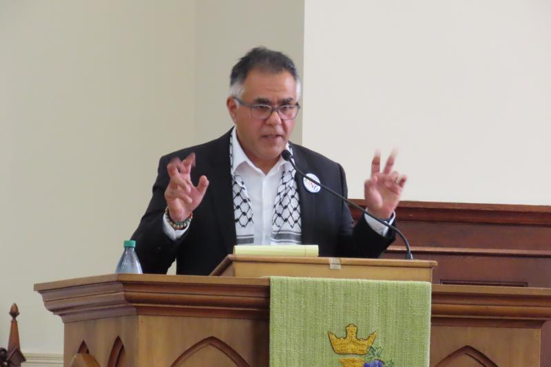 Faisal Khan addressing the PPP meeting in the Second Congregational Church. Courtesy photo﻿