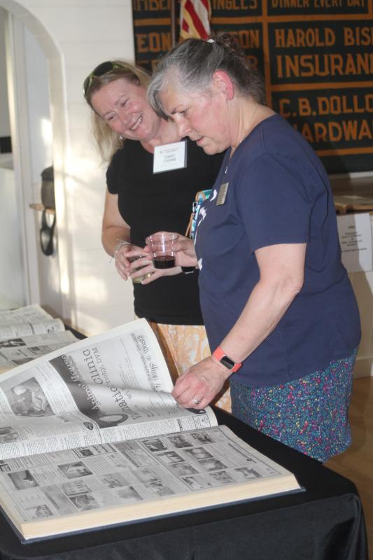 Attendees browse the Boothbay Register archives on display. STEVE EDWARDS/Boothbay Register Attendees browse the Boothbay Register archives on display. STEVE EDWARDS/Boothbay Register