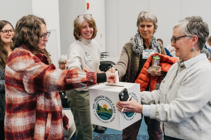 100+ Women Who Care Lincoln County members vote at the January meeting. Melissa Keyser photo