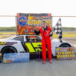 Nick Hinkley collects his $3,000 race winnings in Victory Lane after winning the BIW Shipbuilders 100. Jasen Dickey Photography