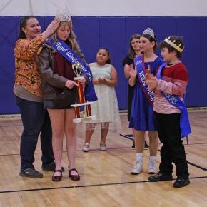 Emily Mirabile places the Royal Windjammer crown on Violet Baldwin's head. STEVE EDWARDS/Boothbay Register