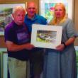 Jennifer and Brian Cook of Hope, R.I., were the winners of a Carlton Plummer painting at the Plummer Gallery and Gardens open house on August 5. The Cooks have been summering at a cottage close to the gallery. Courtesy of Plummer Gallery