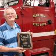 Alna Fire Captain Paul Ouelette holds the plaque the department recently gave him for his service. Ouellette and his wife of 50 years Jackie Ouellette are moving to North Carolina. SUSAN JOHNS/Wiscasset Newspaper