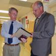 Lincoln County Administrator John O’Connell, left, and Somerset Jail Administrator David Allen discuss the new budget for Somerset County approved by the Board of Corrections in Augusta July 31. CHARLOTTE BOYNTON/Wiscasset Newspaper