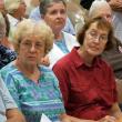 Boothbay Harbor summer resident Connie Machon, left, and her sister, Sharon Barter of Boothbay Harbor, had questions and concerns about the impact of the announced changes. Below, Susan La Placa of Edgecomb awaits the start of the Aug. 22 meeting. SUSAN JOHNS/Wiscasset Newspaper