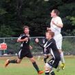 Zack Ellison gets up high and heads the ball in Mountain Valley Conference action. KATHY ONORATO/Wiscasset Newspaper