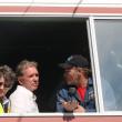 Speedway owners Vanessa Jordan, left, and Richard Jordan hear from race organizer Dale Chadbourne, far right, of Woolwich as the three meet with drivers gathered below the window. SUSAN JOHNS/Wiscasset Newspaper 