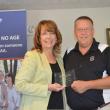 State Director Kim Gore presents the Champion of Children award to Lincoln County Sheriff Todd Brackett in recognition for his commitment and work to keep Maine's children safe and out of crime. 