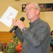 Mike Pander urges people to pick up a copy of Patty Seybold's publication of interviews done with St. Andrews Hospital patients. KEVIN BURNHAM/Boothbay Register