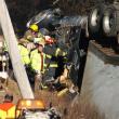 Firefighters from Dresden, Wiscasset and Richmond work to pry a driver from the cab of his tractor trailer after the rig rolled over into a ditch off Middle Road in Dresden Monday, Dec. 24. JOHN MAGUIRE/Wiscasset Newspaper