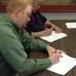 Lincoln County Communications Association President Casey Stevens, left, and Vice President Pam Reed sign a three-year contract for services with the county November 20. JOHN MAGUIRE/Wiscasset Newspaper
