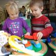 Grace Segerstrom and J. J. Pray enjoy the train and tracks set donated to the Wiscasset Public Library Children’s Room by Papa Geppetto’s Workshop. Courtesy of Wiscasset Public Library