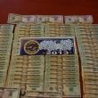 The Oxycodone and money seized during the arrest of Andrew Goupil and Joseph Dupaw, below.